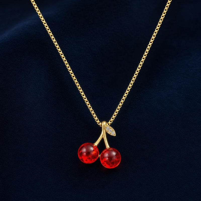 AYNOHA gold necklace with red cherries pendant - studio