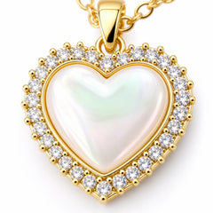AYNOHA gold heart necklace with mother-of-pearl on white - close-up detail