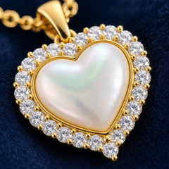 AYNOHA gold heart necklace with mother-of-pearl and cubic zirconia - close-up detail