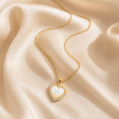 AYNOHA gold heart necklace with mother-of-pearl and cubic zirconia - styled