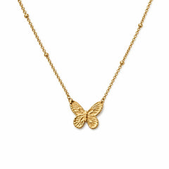 AYNOHA gold butterfly necklace on white - studio