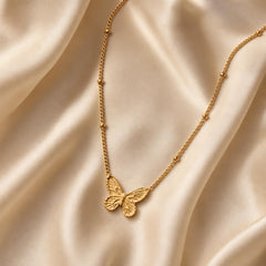 AYNOHA gold butterfly pendant necklace - styled