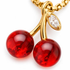 AYNOHA gold cherries necklace on white - close-up detail