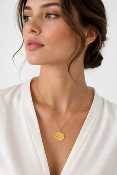 AYNOHA gold floral medallion necklace on white - worn by model