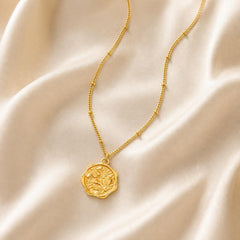 AYNOHA gold floral medallion necklace - styled